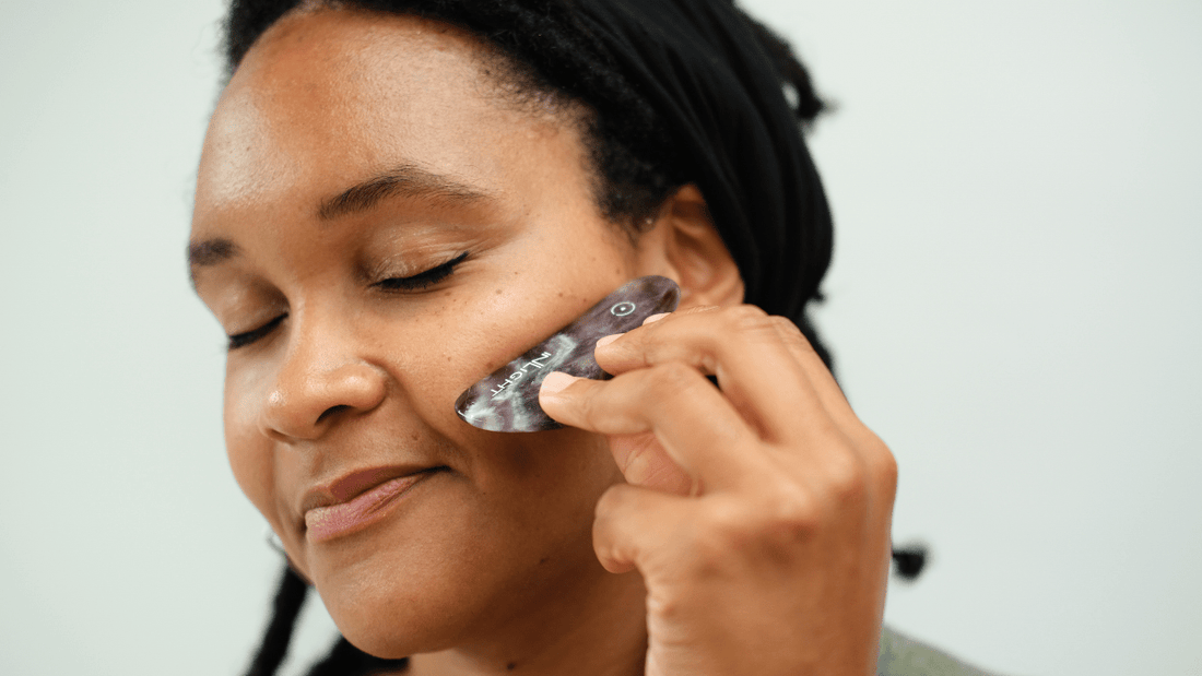Self care using amethyst facial massage tools. Encourage lymphatic drainage and natural glow. Inlight Beauty blog