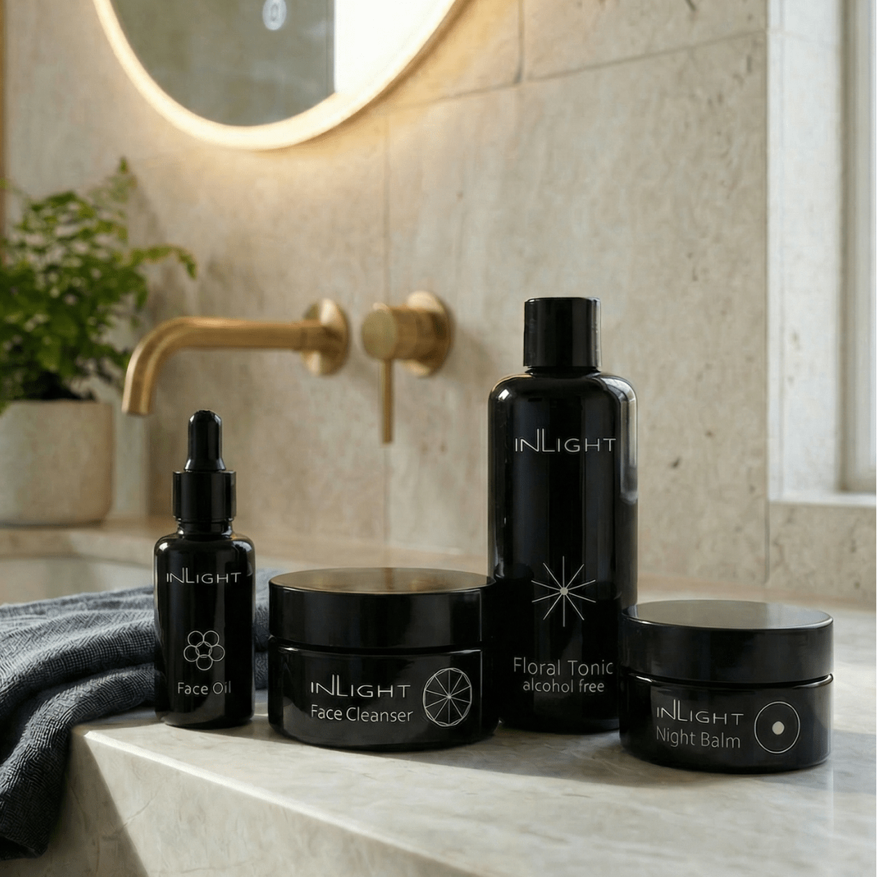 Inlight day and night bundle set featuring certified organic skincare in miron glass bottle with grey organic muslin cloth